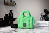 marc jacobs the teddy micro fluffy green tote bag on marble table
