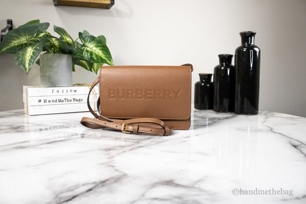 burberry hampshire small tan crossbody on marble table