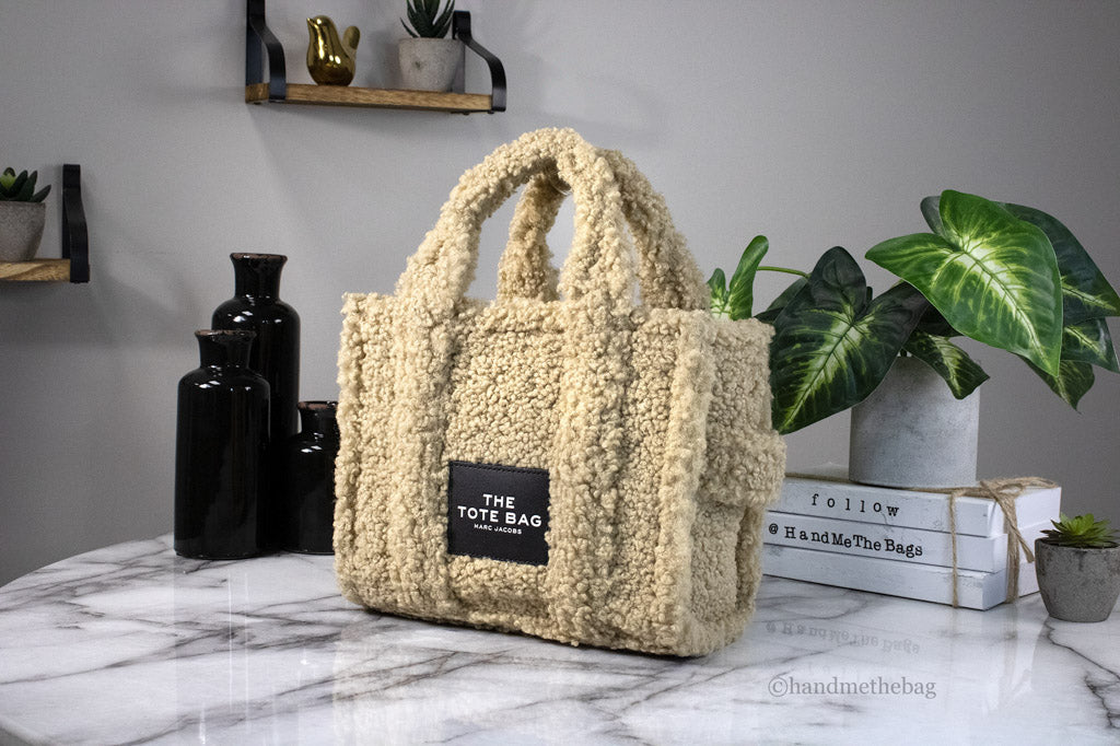 marc jacobs the teddy mini tote beige on marble table