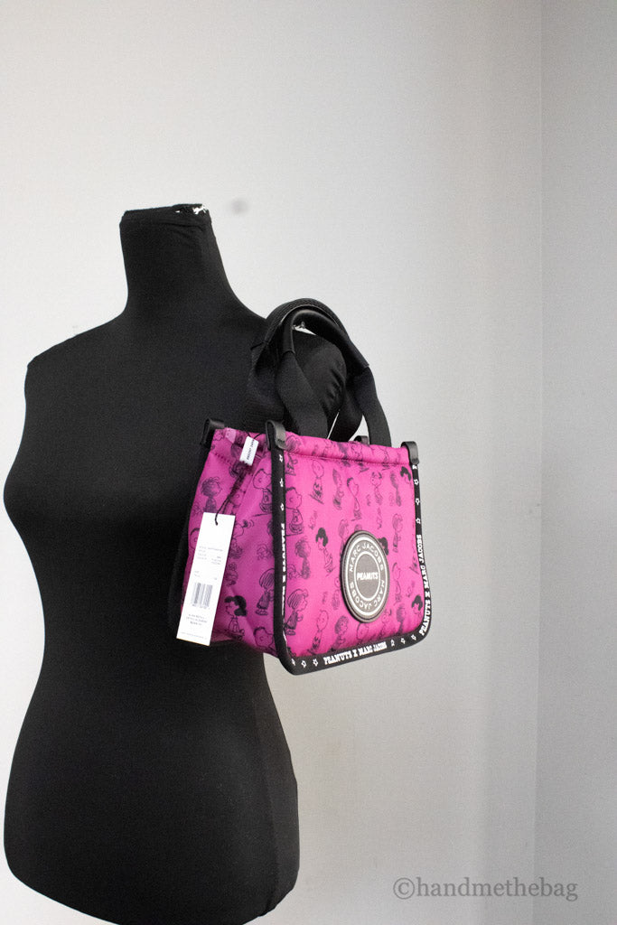 marc jacobs x peanuts fuchsia tote on mannequin