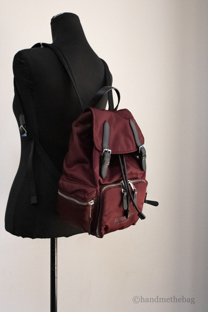 burberry burgundy nylon backpack on mannequin
