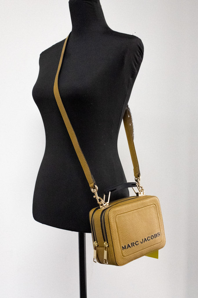 marc jacobs the box golden brown crossbody on mannequin