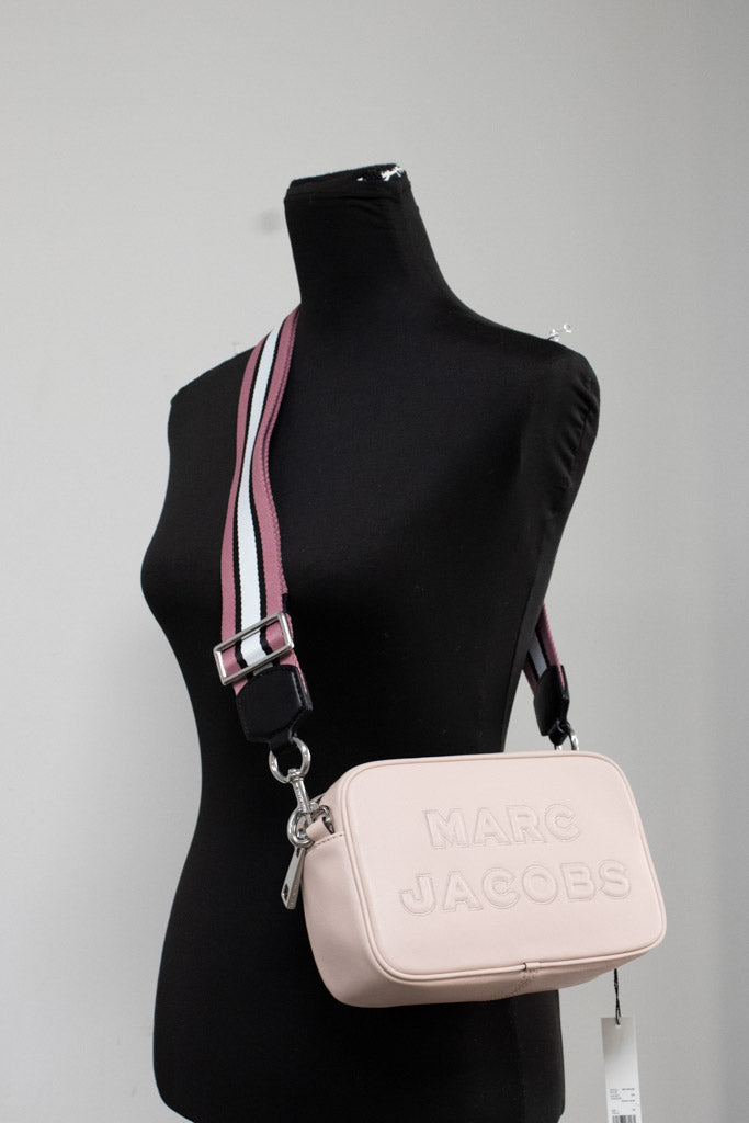 marc jacobs flash peach whip camera crossbody on mannequin