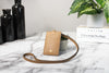 tory burch emerson moose lanyard on marble table