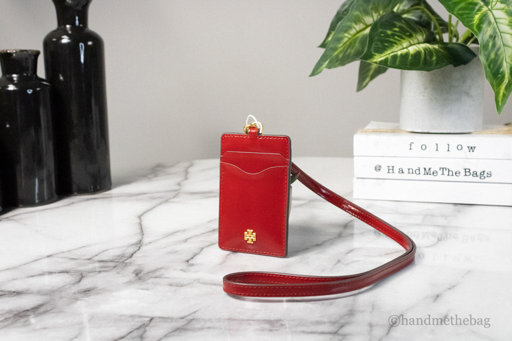 tory burch emerson lipstick red lanyard on marble table