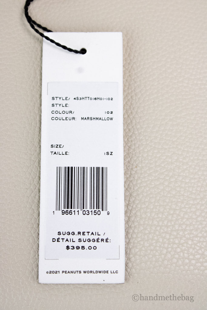 marc jacobs x peanuts woodstock tote tag on white background