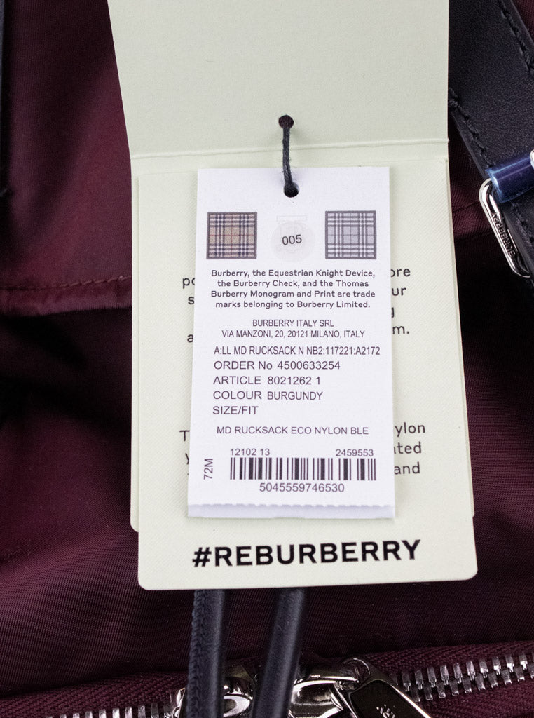 burberry burgundy nylon backpack tag on white background