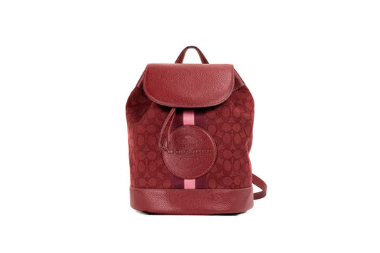 coach dempsey red apple canvas backpack on white background